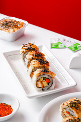 sushi is a Japanese dish of prepared vinegared rice, usually with some sugar and salt, accompanied by a variety of ingredients such as seafood, often raw and vegetables.