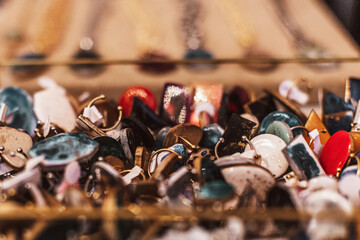 Lots of earrings jewelry on the showcase of women's accessories