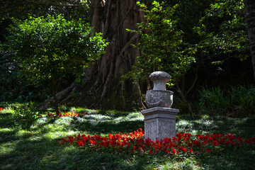 Stone garden urn in a beautiful corner of Park Liberdade, Sintra, Portugal