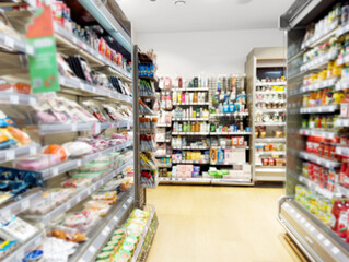 choosing a dairy products at supermarket.empty grocery cart in an empty supermarket