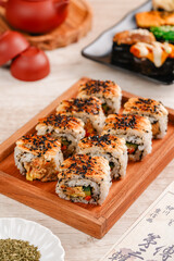 sushi is a Japanese dish of prepared vinegared rice, usually with some sugar and salt, accompanied by a variety of ingredients such as seafood, often raw and vegetables.