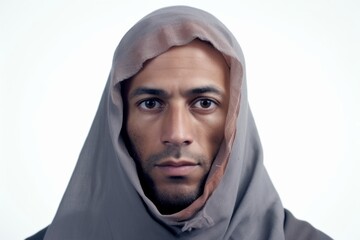 Medium shot portrait photography of a man in his 40s visibly in discomfort and fatigue from an autoimmune disease like lupus wearing hijab against a white background 