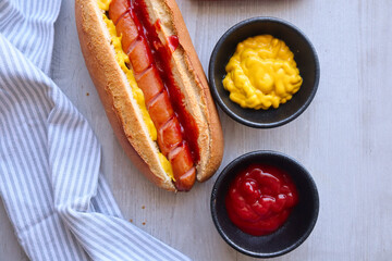 hot dog and ketchup and mustard on a crispy roll