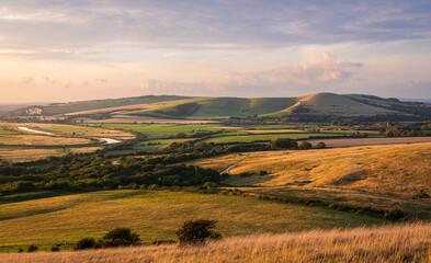 Golden hour view from Itford Hill in the south downs of the Ouse valley and Lewes Downs east Sussex south east England UK © SuxxesPhoto
