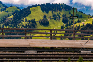 Nice view of the Rigi Kulm cogwheel railway mountain station with a lovely mountainous landscape in...