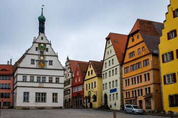 Colourful street on a main square of Rothenburg ob der Tauber, the Franconia region of Bavaria, Germany. Medieval old town. The most romantic town in Germany.