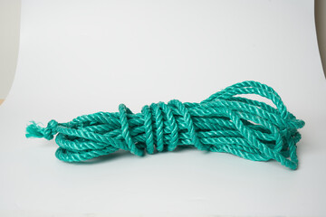 green plastic rope on white background