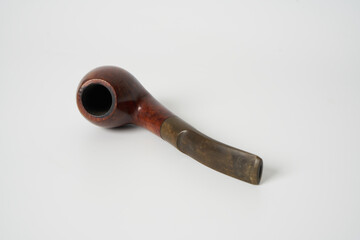 wooden handmade pipe on white background