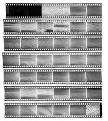 real scan of seven empty 35mm black and white filmstrips with massive scanning light interferences...