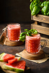 watermelon drink with basil on a dark background