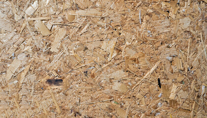 Close up of a recycled compressed wood chippings board