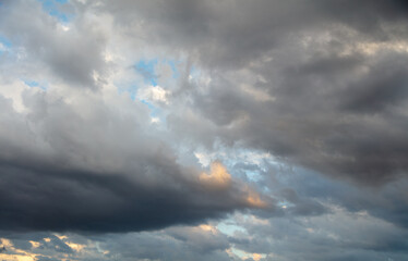 Thunderclouds in the sky at sunset.