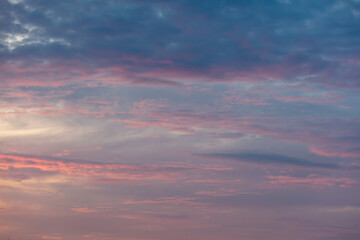 Pink blue clouds at sunset as background