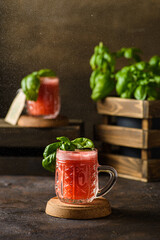 watermelon drink with basil on a dark background