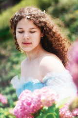 Fototapeta premium Fairytale with beautiful young girl as a flower fairy