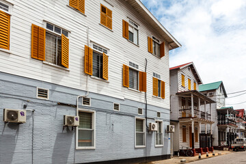 Facade of an old white wooden house in the historic center of Paramaribo, Suriname, South America