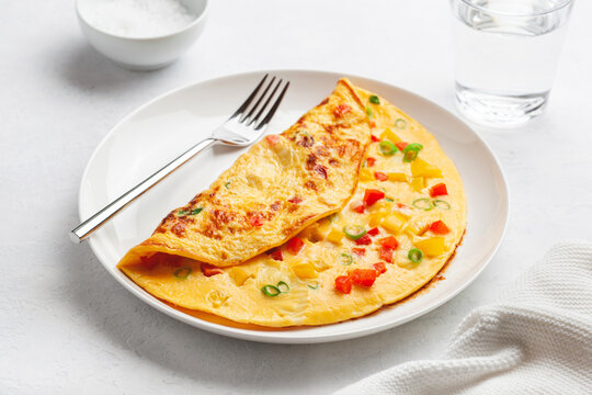 omelette with tomato, bell pepper onion and cheese. healthy breakfast