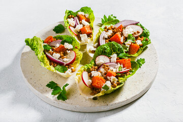 healthy sweet potato lettuce boats with radish, feta cheese, lentils
