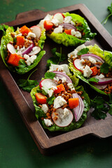 healthy sweet potato lettuce boats with radish, feta cheese, lentils