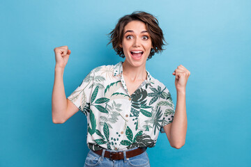 Photo portrait of lovely young lady raise fists excited win lottery wear trendy print leaves...