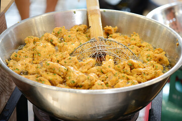 fried fish-paste balls at street food market in Bangkok, Thailand