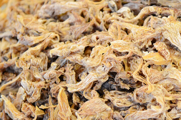 Dried salted fish as a background. Close-up.