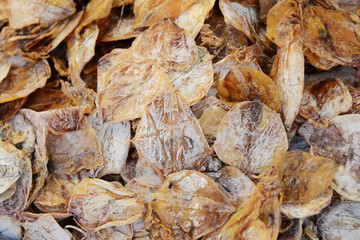 Fototapeta na wymiar Dried salted fish as a background. Close-up.