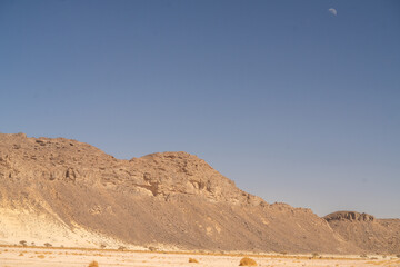 view in the Sahara desert of Tadrart rouge tassili najer in Djanet City  ,Algeria.colorful orange sand, rocky mountains