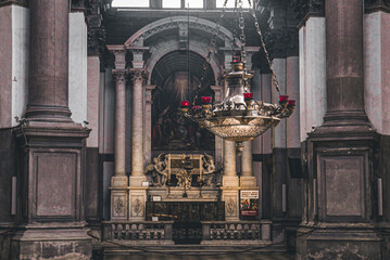 interior of a church with altar and chandelier