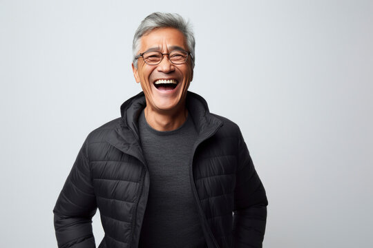 portrait of a smiling Asian person 60 years old, elder