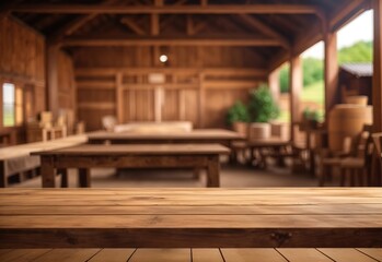 The empty wooden brown table top with blur background of farm and barn