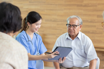 Nursing Home Care concept. Friendly nurse caregiver supporting an eldery.