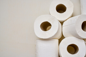 White toilet paper on a bathroom shelf.