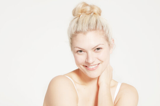 Portrait of model with hair bun.