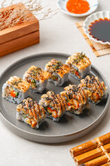 sushi is a Japanese dish of prepared vinegared rice, usually with some sugar and salt, accompanied by a variety of ingredients such as seafood, often raw and vegetables.