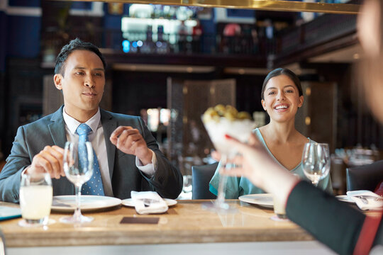 Businesspeople at bar of restaurant