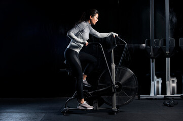 Woman using exercise machine