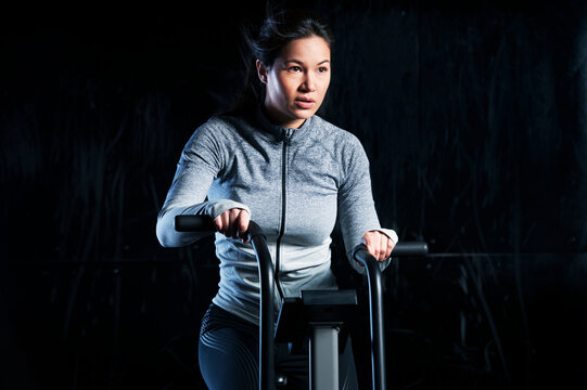 Woman using exercise machine