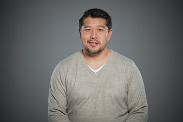 Portrait of mid adult man wearing sweater.