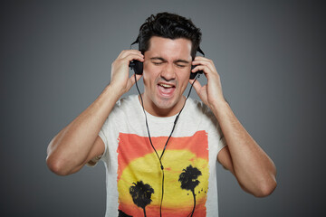 Portrait of young man wearing headphones.