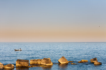 Fisherman on sunset