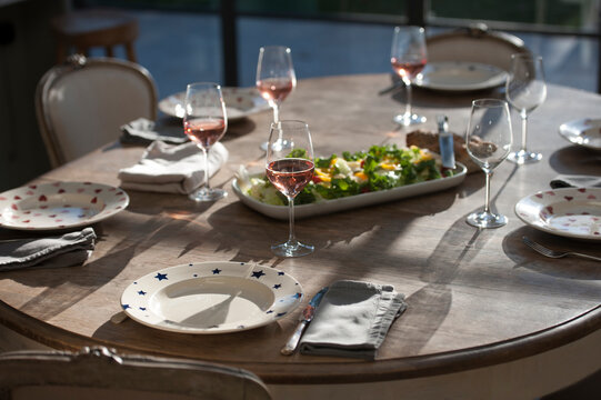 Salad and wine on dining table
