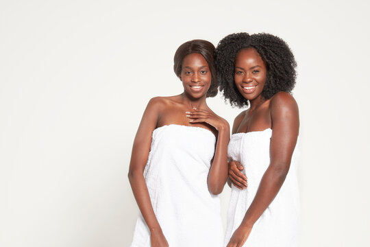 Young women posing in towels, real women