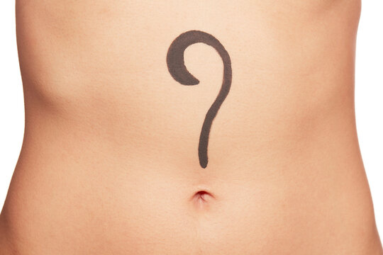Question mark on young woman's abdomen