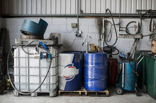 Oil barrels in mechanic workshop