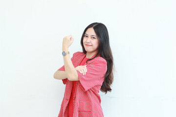 portrait of beautiful asian woman wearing red outfit with strong hand gesture