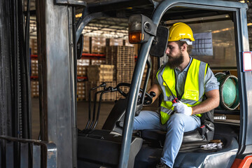 forklift operator man working in distribution factory warehouse