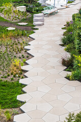 Path with large stone slabs through a garden