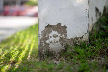 White wall ruined by time, bad weather and humidity. Cracks, mold, peeling paint and plaster. Texture