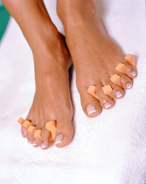 Woman's feet getting pedicure
